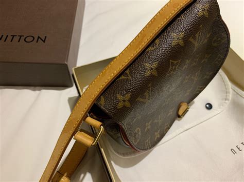 louis vuitton sling wallet.